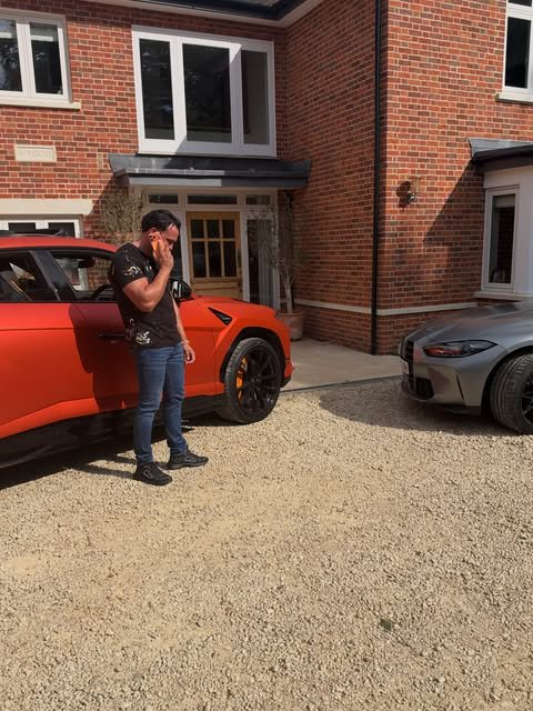 Addam Sattar beside the Urus and a grey BMW on the drive