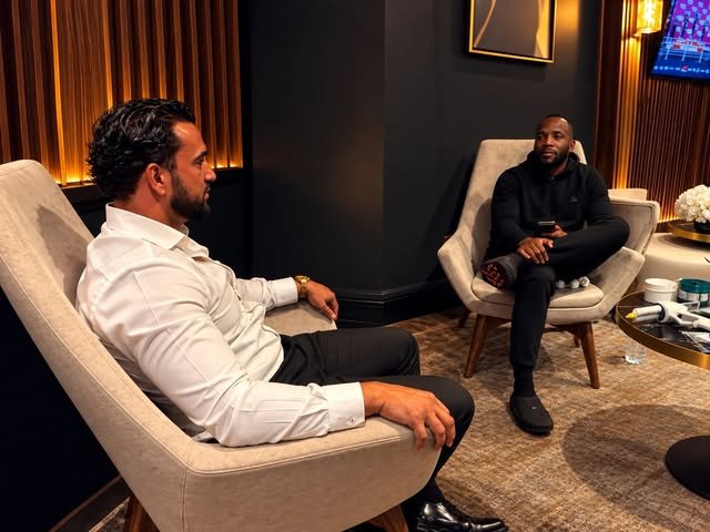 Addam Sattar in conversation in a lounge